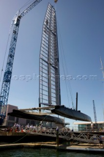 Oracle Racing rig and float the first AC45 in Auckland. 16/1/2011. The wing sail mast is stepped with a crance.