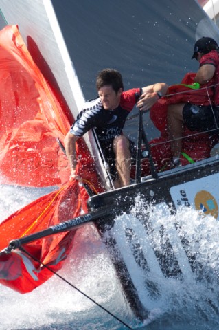 Emirates Team New Zealand bowman Richard Meacham ready to let the genoa go for a downwind run in the
