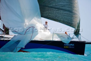 KEY WEST, FLORIDA - January 16th 2007: Bowman retrieves spinnaker on Numbers IRC1 during racing on Day 2 of Key West Race Week 2007 on January 16th 2007. Key West Race Week is the premier racing event in the winter season. (Photo by Sharon Green/Kos Picture Source)