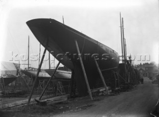 Yacht Britannia on stocks on the hard at Marvins Yard on the south coast, UK, in 1930 prior to being converted to a J-Class
