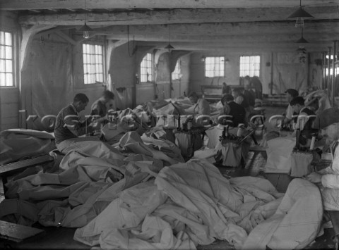 Hand sewing sails in Ratsey  Lapthorn Ltd on the south coast UK in 1930