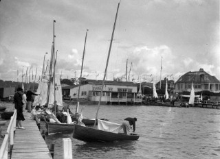 The 12ft one design N Class dinghy designed by Uffa Fox alongside the jetty during the Yachting World Parkstone Yacht Club regatta in 1936, UK