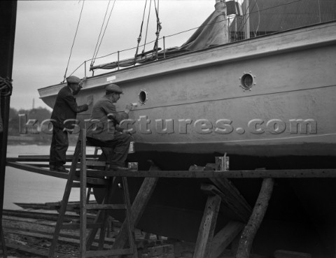 A large motor yacht with its hull being painted on a slipway at Mays Yard in Lymington now known as 