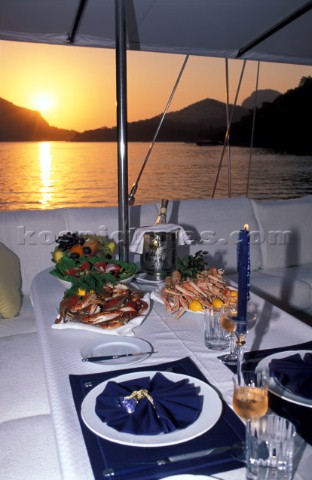 Set table on a sailing yacht during sunset