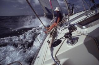 Man sitting on sailing yacht looking at view