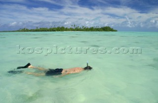 Snorkeling off Pearl beach resort on Aitutaki Island, Cook Islands, South Pacific.