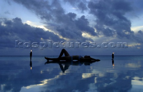 Relaxing at Pacific resort during sunset on Aitutaki Island Cook Islands South Pacific