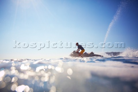 Man jet skiing in the mediterranean sea