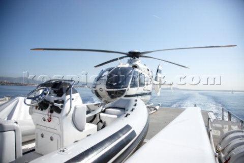 Helicopter on helideck of superyacht
