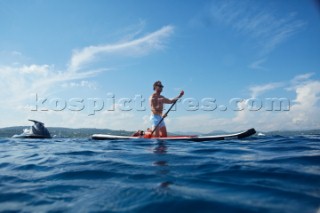 Man riding a paddleboard