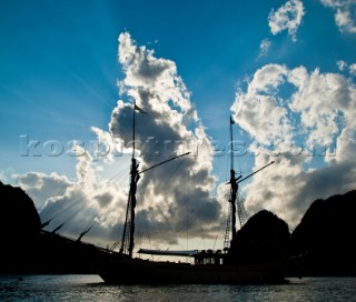 Cruising in Indonesia, silhouette of a traditionail Phinisi boat