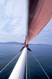 Sailing into Bar Harbor, ME on the bowsprit of a schooner on a beautiful summer day.  The mountains of Acadia National Park are in the distance on the left.