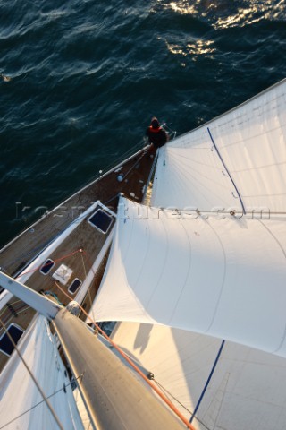 Anton Muzik stands at the bow while sailing aboard the Swan 48 sloop COLIBRI on the waters of San Fr