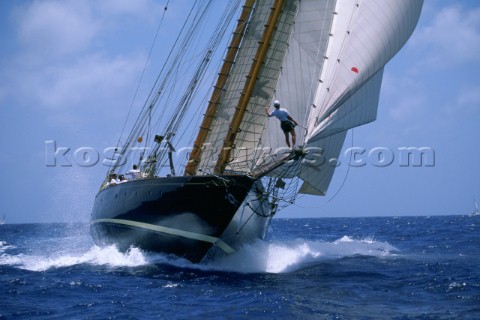Bowman signals at the start sailing Nat Hereshoffs schooner Mariette in the Antigua Classic Yacht Re