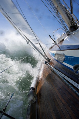 A 39 foot Nautor Swan sailboat crashes through waves while sailing in heavy weather on April 15 2004