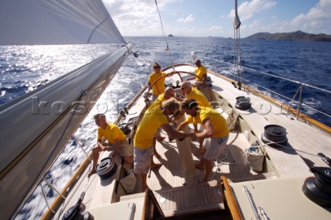 The crew onboard WClass yacht Wild Horses work together during a race near Saint Bartholomew French 