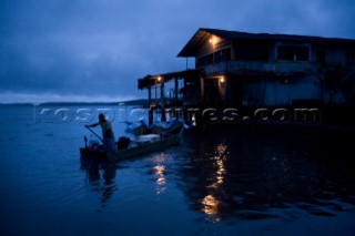 A fisherman leaves from the isolated fishing pueblo of Limones in the province of Esmeraldas, on August 17, 2008.  Many of the pueblos in the province of Esmeraldas, Ecuador, have become more dangerous in recent years because of the drug trade and its proximity to the Colombian jungle.  Fishing is the only job in some villages.  A lack of opportunities has left many people frustrated, especially when there are less fish.  Although many of these communities are living in extreme poverty, a strong sense of identity and family holds the people together and creates a positive and upbeat attitude.