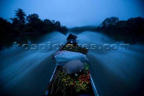 A boat goes down the Cayapas River leaving San Miguel an Afro Ecuadorian community located 3 hours u