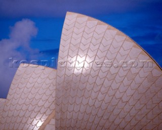 The roof or sails of the Sydney Opera House against a bright blue sky. 1999