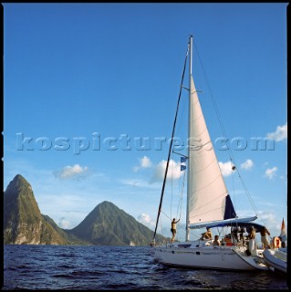 SOUFRIERE, ST. LUCIA - MARCH 2006:  A sailboat returns to Soufriere harbor, with the landmark Piton mountains looming in the background. (Petit Piton at left, Gros Piton at right.)  (Photo by Katja Heinemann/Aurora)