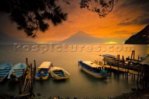 long time exposure boats dock Lake Atitlan from the town of Santa Cruz Guatemala