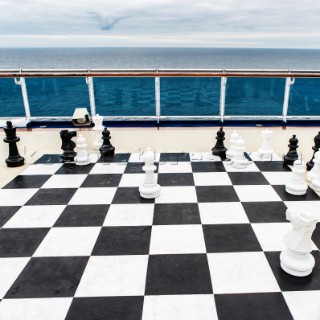 Giant chess board on the deck of a cruise ship.