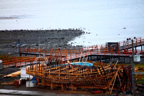 A traditional wooden fishing boat under construction on the Costnera of Puerto Williams  The boat bu