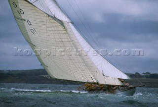 A beautiful classic yacht, an 85 gaff rigged sloop races in the Americas Cup, where the dark skies of Cowes, England predict stormy seas.