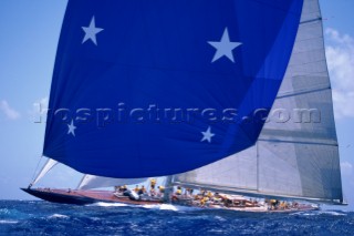 Americas Cup J Class yacht Endeavour sails under spinnaker in the Antigua Classic Yacht Regatta.