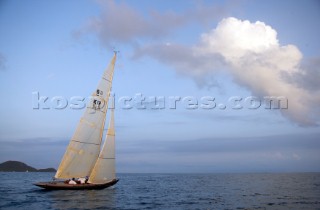 Calm winds off the Antigua coast carry the 6 Meter, Nada upwind at sunset.