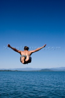 Woods Wheatcroft dives into Lake Pend Oreille near his house in Sandpoint, Idaho