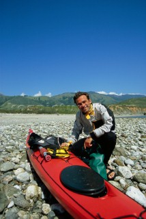 Sea kayak guide Josh Mendenhall poses for a portrait at the Big Sur Rivermouth while on a sea kayak trip on the Big Sur coast of California