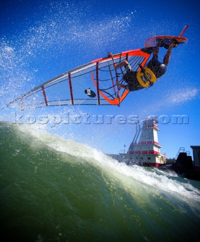 Windsurfer slides a sweet table top for the viewing pleasure of a passing Columbia River Barge Capta