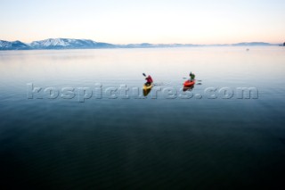 Corey Rich photographs Spencer Ray during an early morning paddle on Lake Tahoe, Stateline, NV.