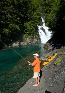 George Bahm enjoys fly fishing during a wilderness adventure in Futaleufu, Chile.