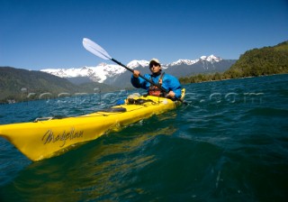 Jonathan Eisenberg paddles a sea kayak during a wilderness adventure in Lago Yelcho, Chile.