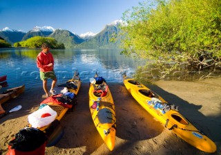Mike Powers looks over his gear during a kayaking adventure in Lago Yelcho, Chile.