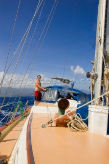 Sam Winslow sails the Na Pali Coast, Kauai, Hawaii