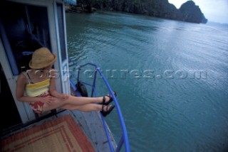 Hanh Quach hanging out on a boat in Halong Bay, Vientam.