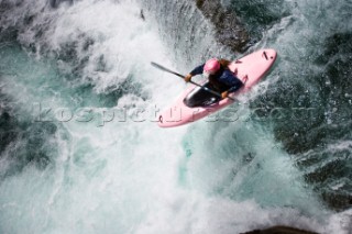 An expert whitewater kayaker runs Shepherds Falls on the Wind River near Carson, Washington on July 30, 2008.  Model Released.  Heather Herbeck.