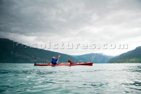 Sea kayaking on the turquoise waters of Norways largest fjord the Sognefjord 