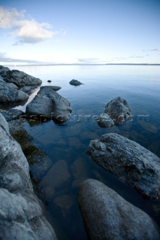 Rocks along the shoreline of Lake Sebago Maine  This image was taken in the late afternoon while at 