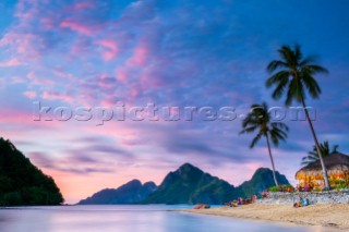 Las Cabanas Beach Resort on Marimegmeg Beach at sunset, El Nido, Palawan, Philippines