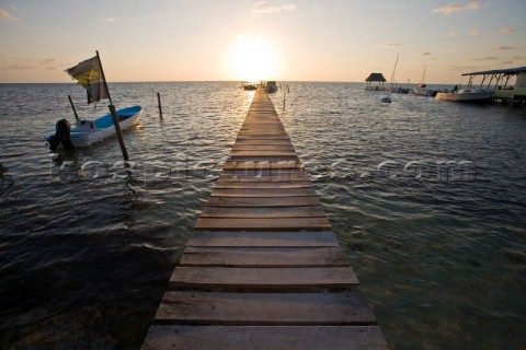 Belize Central America  Sunrise at one of the many private wooden piers on the Caye Caulker waterfro