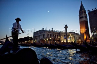 A gondolier navigates just offshore of Venice, Italy, at night. Dave Yoder/Aurora Photos/Kos Pictures