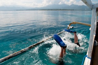 Two scuba divers entering the water near Gili Air, Gili Islands, Lombok Island, Indonesia, on the 25 September 2010. Thomas Pickard/Aurora Photos/Kos Pictures