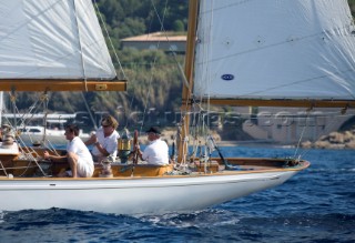 Griff Rhys Jones in full concentration on the helm as they match race Skylark